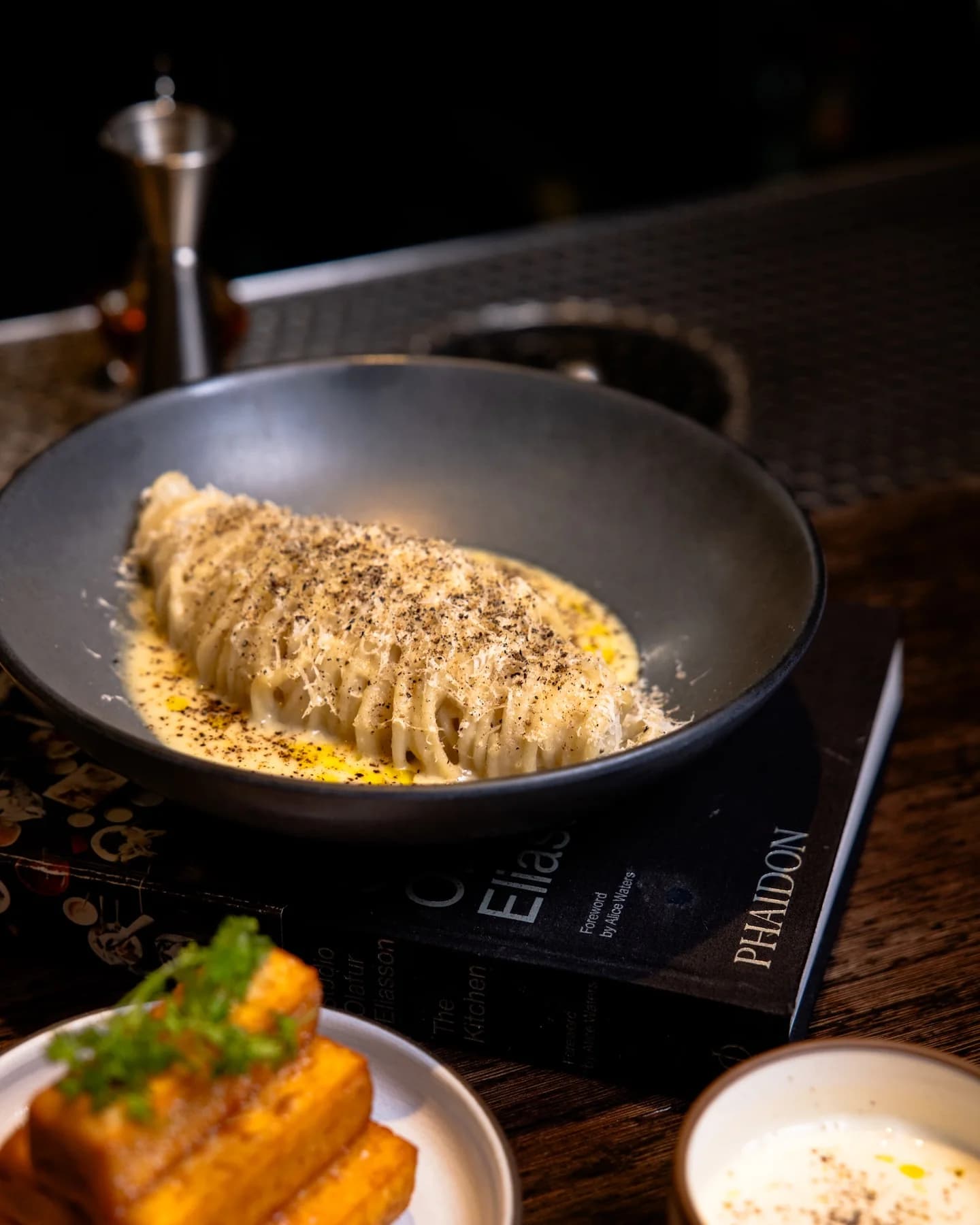 House-made pasta with black pepper and grated cheese at Juniper