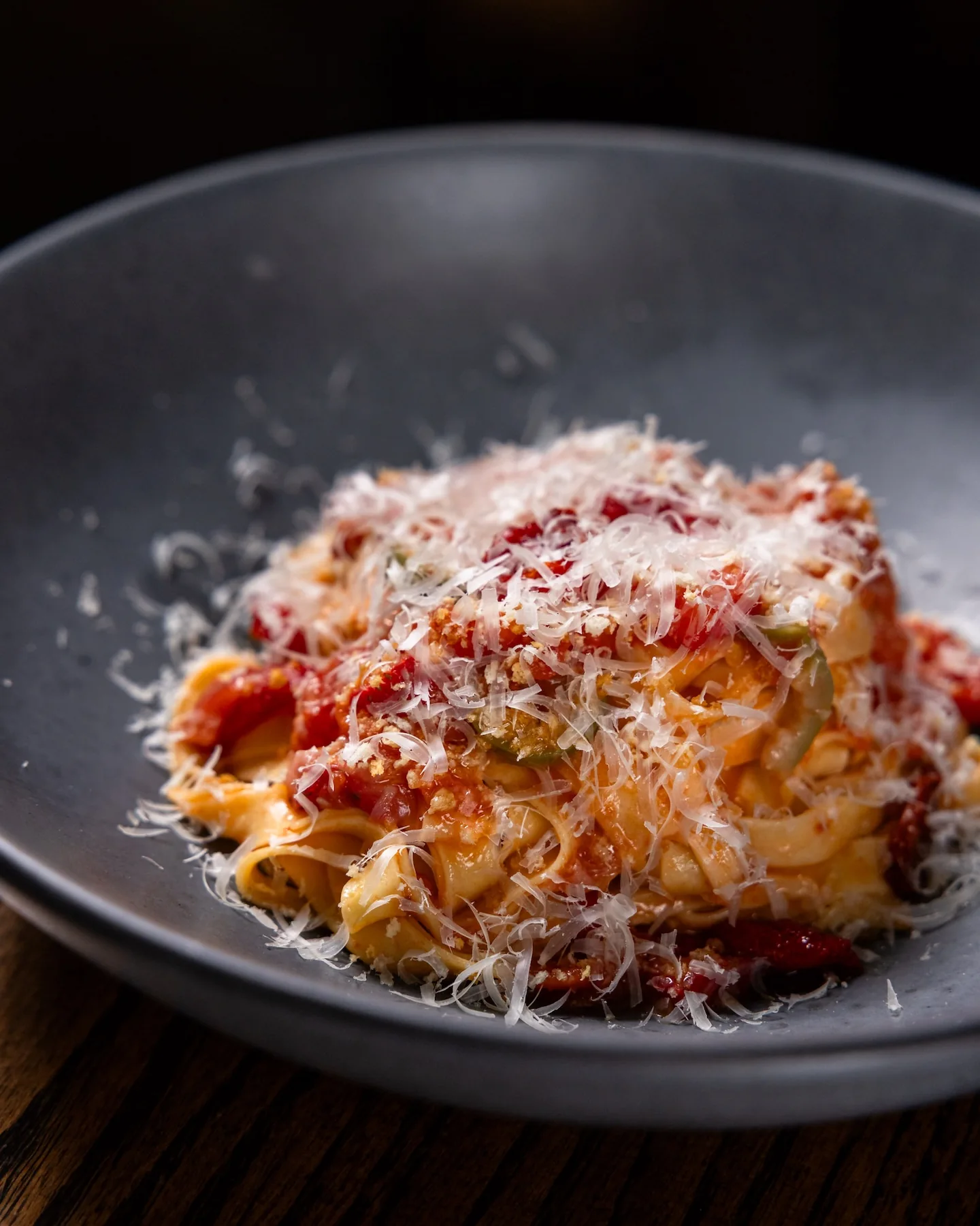 House-made pasta with tomatoes and shaved parmesan at Juniper